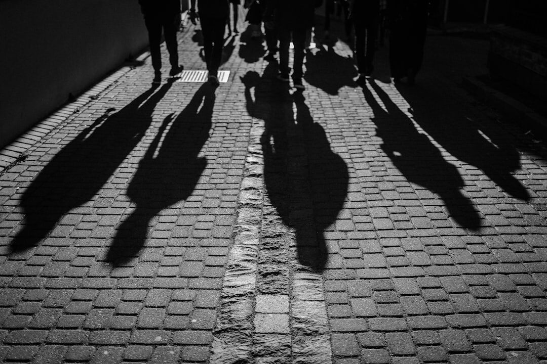 Silhouette walking through urban alley