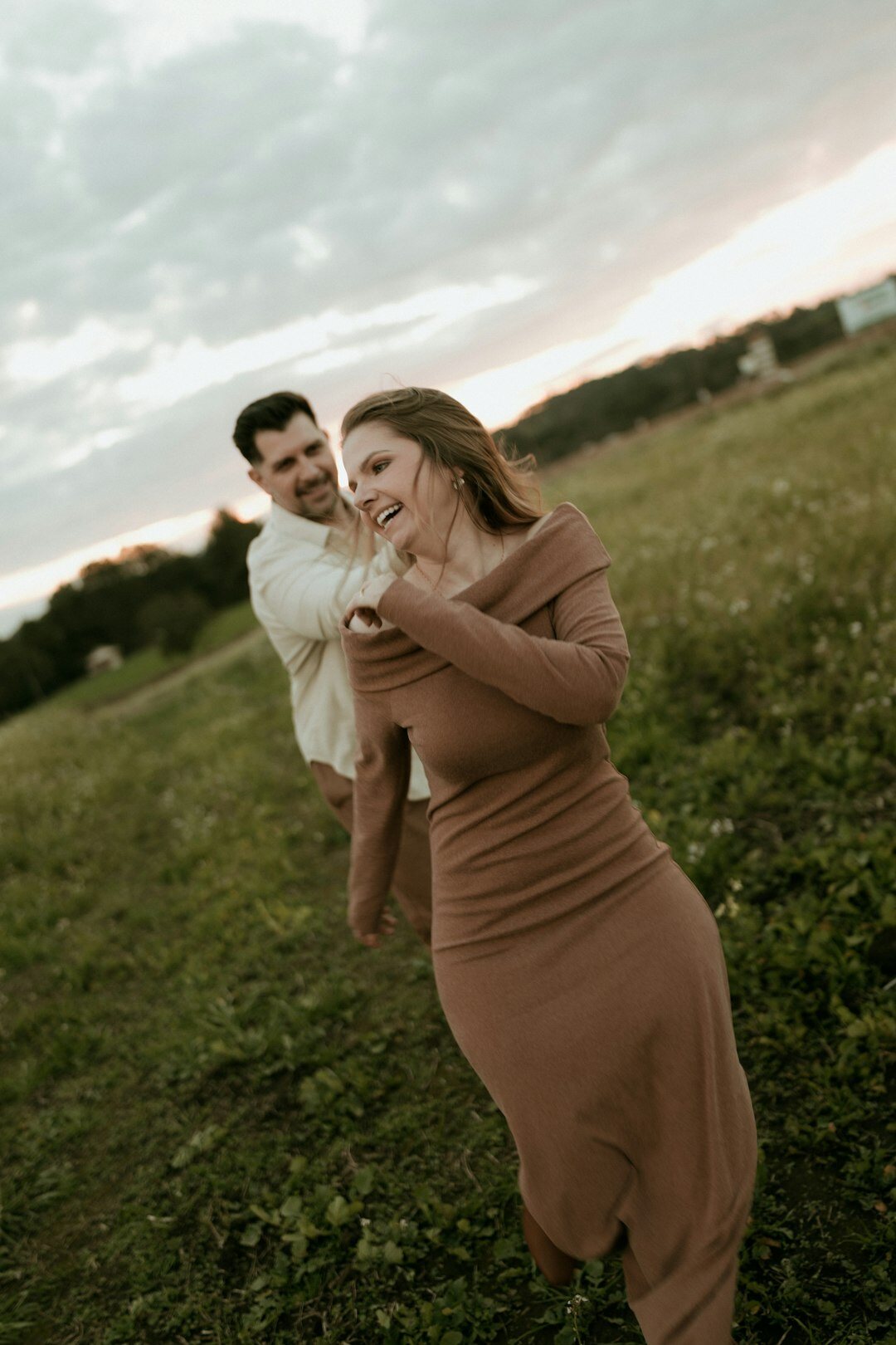 Couple laughing together outdoors